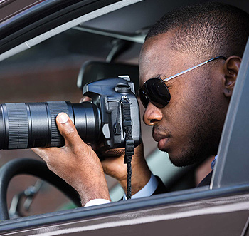 Experienced private investigators at Blue Falcons Investigation reviewing case files