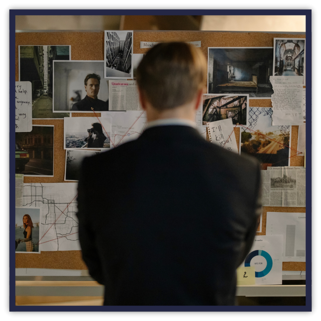 a man staring at a board with a lot of different information